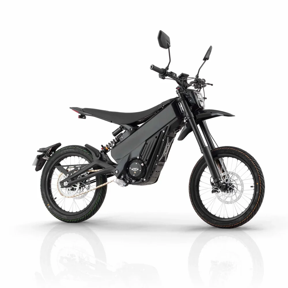 Talaria X3 Pro 5kw Electric Dirt Bike Talaria X3 Pro 5kw Electric Bike transitioning from urban street to a light off-road trail in Europe.