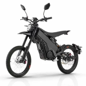 Talaria X3 Pro 5kw Electric Bike transitioning from urban street to a light off-road trail in Europe.