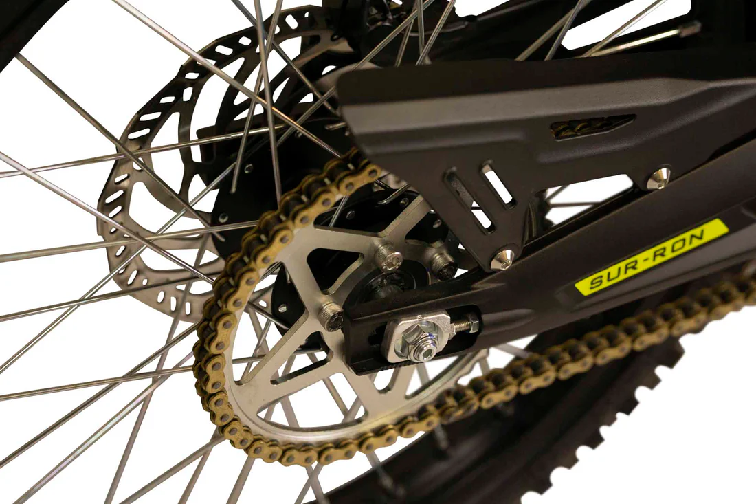Sur Ron Light Bee-X Sur Ron Light Bee-X electric dirt bike rider navigating a challenging forest trail in Europe.