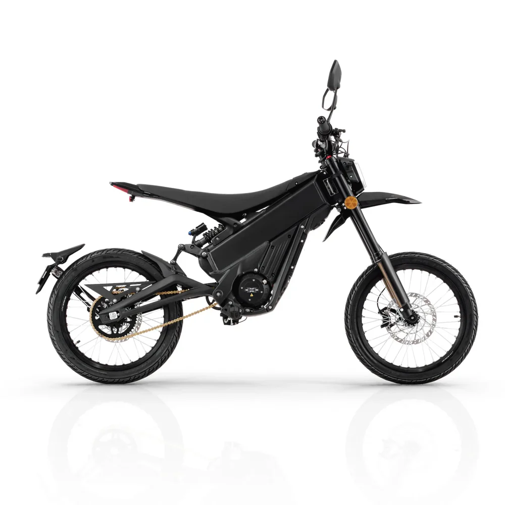 Talaria X3 Pro 5kw Electric Dirt Bike Talaria X3 Pro 5kw Electric Bike transitioning from urban street to a light off-road trail in Europe.