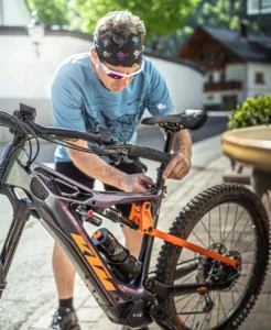 KTM MACINA KAPOHO MASTER 43 cm '23 black electric bike KTM MACINA KAPOHO MASTER 43 cm '23 black electric mountain bike riding on a steep trail in Europe